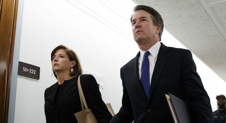 Brett Kavanaugh, President Donald Trump's Supreme Court nominee, and his wife Ashley Estes Kavanaugh, hold hands as they arrive for a Senate Judiciary Committee hearing on Capitol Hill in Washington, Thursday, Sept. 27, 2018. Brett Kavanaugh, President Donald Trump's Supreme Court nominee, and his wife Ashley Estes Kavanaugh, hold hands as they arrive for a Senate Judiciary Committee hearing on Capitol Hill in Washington, Thursday, Sept. 27, 2018.