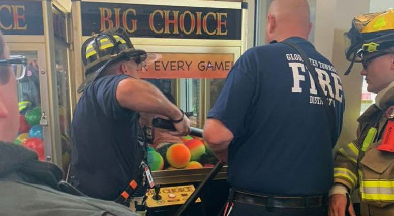 Emergency crews rescue a child from a game at the Gloucester Premium Outlets in Blackwood, N.J. Emergency crews rescue a child from a game at the Gloucester Premium Outlets in Blackwood, N.J.