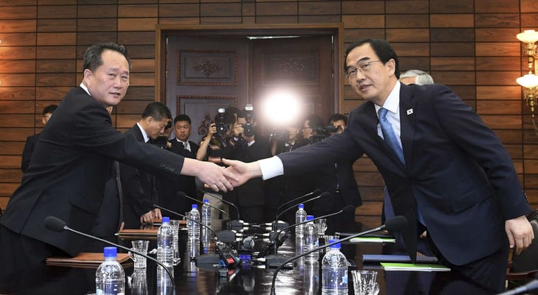 South Korean Unification Minister Cho Myoung-gyon, right, shakes hands with his North Korean counterpart Ri Son Gwon during their meeting at the northern side of Panmunjom in the Demilitarized Zone, North Korea, Monday, Aug. 13, 2018. South Korean Unification Minister Cho Myoung-gyon, right, shakes hands with his North Korean counterpart Ri Son Gwon during their meeting at the northern side of Panmunjom in the Demilitarized Zone, North Korea, Monday, Aug. 13, 2018.