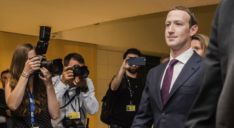 Facebook CEO Mark Zuckerberg leaves the EU Parliament in Brussels on Tuesday, May 22, 2018. Facebook CEO Mark Zuckerberg