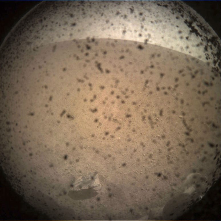 This photo provided by NASA shows the first image acquired by the InSight Mars lander after it touched down on the surface of Mars Monday, Nov. 26, 2018. This photo provided by NASA shows the first image acquired by the InSight Mars lander after it touched down on the surface of Mars Monday, Nov. 26, 2018.
