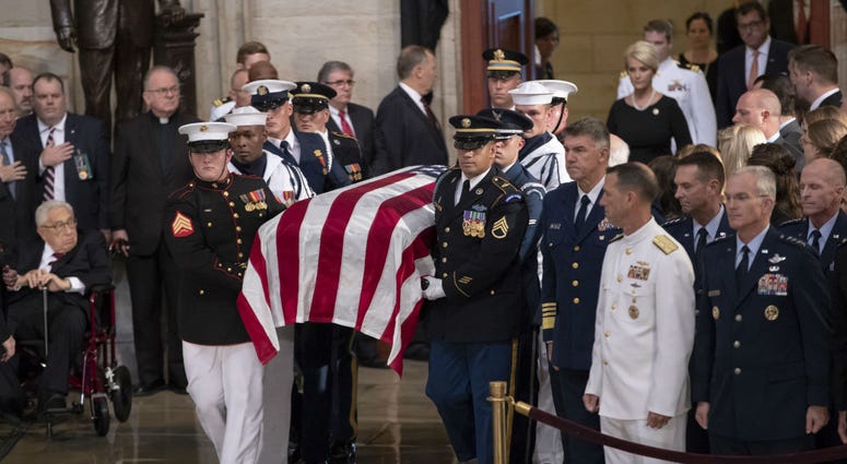 The flag-draped casket bearing the remains of Sen. John McCain of Arizona, who lived and worked in Congress over four decades, is carried into the U.S. Capitol rotunda. The flag-draped casket bearing the remains of Sen. John McCain of Arizona, who lived and worked in Congress over four decades, is carried into the U.S. Capitol rotunda.