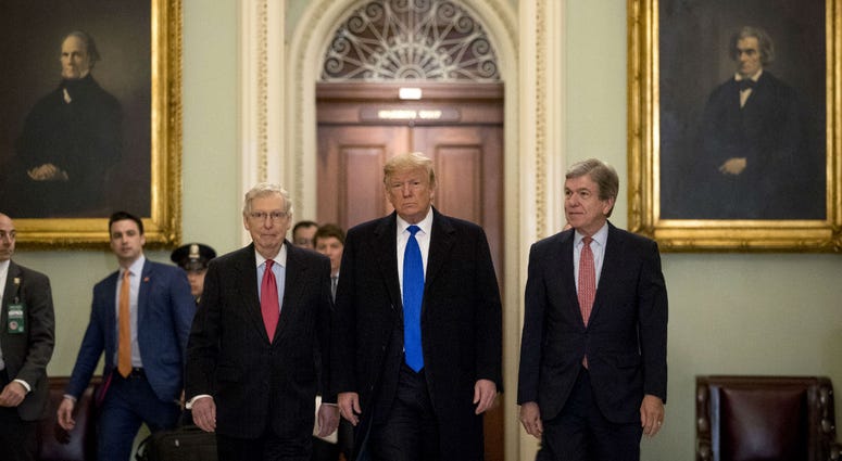 President Donald Trump accompanied by Senate Majority Leader Mitch McConnell of Ky., left, and Sen. Roy Blunt, R-Mo., right, arrives for a Senate Republican policy lunch on Capitol Hill in Washington, Tuesday, March 26, 2019. President Donald Trump accompanied by Senate Majority Leader Mitch McConnell of Ky., left, and Sen. Roy Blunt, R-Mo., right, arrives for a Senate Republican policy lunch on Capitol Hill in Washington, Tuesday, March 26, 2019.