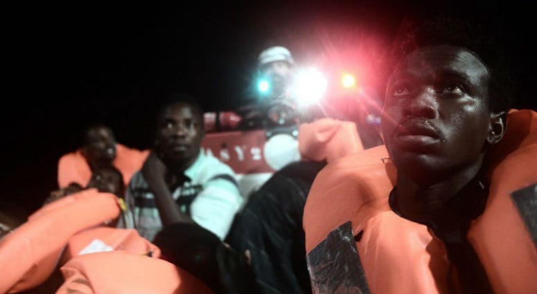 This undated photo released by French NGO "SOS Mediterranee" on June 11, 2018, shows migrants about to board SOS Mediterranee's Aquarius ship and Doctors Without Borders NGOs, in the Mediterranean Sea. This undated photo released by French NGO "SOS Mediterranee" on June 11, 2018, shows migrants about to board SOS Mediterranee's Aquarius ship and Doctors Without Borders NGOs, in the Mediterranean Sea.