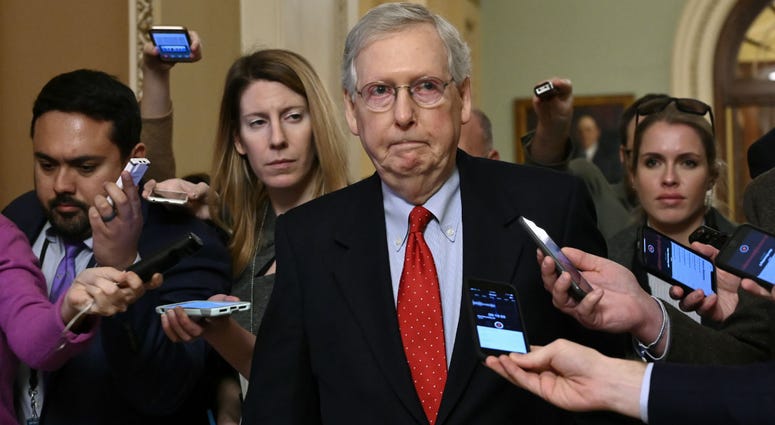 Senate Majority Leader Mitch McConnell of Ky., center, talks with reporters as he walks on Capitol Hill in Washington, Wednesday, Jan. 2, 2019. Senate Majority Leader Mitch McConnell of Ky., center, talks with reporters as he walks on Capitol Hill in Washington, Wednesday, Jan. 2, 2019.