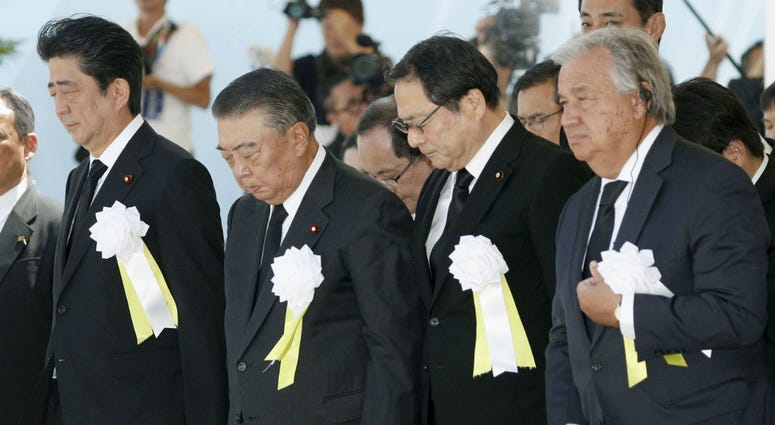 United Nations Secretary-General Antonio Guterres, right, and Japanese Prime Minister Shinzo Abe, left, offer a silent prayer during a ceremony at Nagasaki Peace Park in Nagasaki, southern Japan Thursday, Aug. 9, 2018. United Nations Secretary-General Antonio Guterres, right, and Japanese Prime Minister Shinzo Abe, left, offer a silent prayer during a ceremony at Nagasaki Peace Park in Nagasaki, southern Japan Thursday, Aug. 9, 2018.