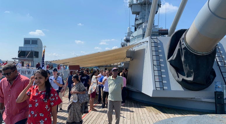 40 prospective citizens board the Battleship New Jersey for a Fourth of July naturalization ceremony. 40 prospective citizens board the Battleship New Jersey for a Fourth of July naturalization ceremony.