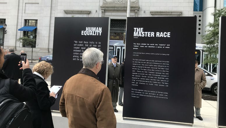 The plaza features pillars that contrast Nazi themes with American values. The plaza features pillars that contrast Nazi themes with American values.