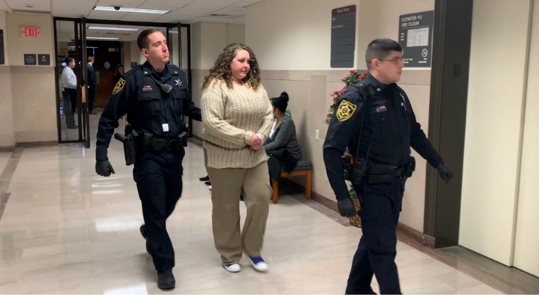 Nicole Cadwalader is escorted after her sentencing, Feb. 24, 2020. She pleaded guilty but mentally ill to killing her grandmother. Nicole Cadwalader