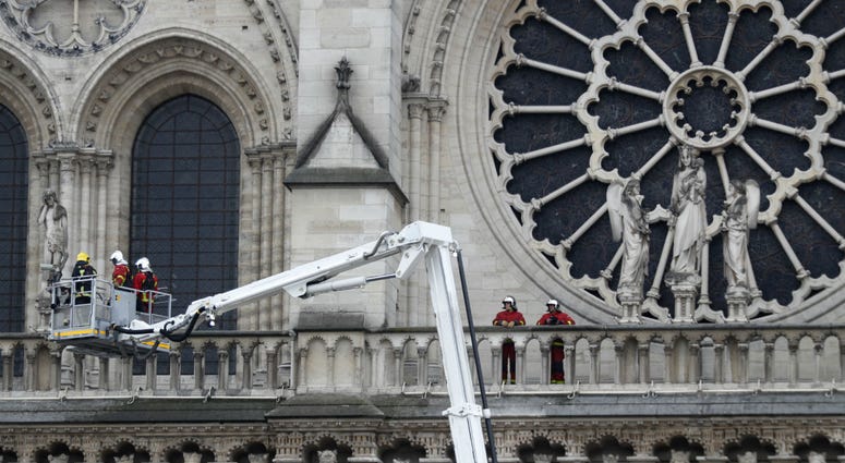 Firefighters work at the facade of Notre Dame cathedral Tuesday April 16, 2019 in Paris. Firefighters work at the facade of Notre Dame cathedral Tuesday April 16, 2019 in Paris.