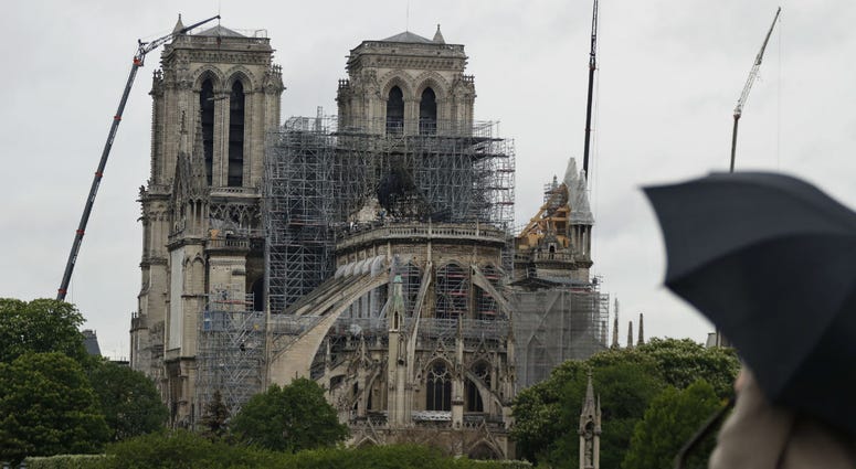 Cranes work at Notre Dame cathedral, in Paris, Thursday, April 25, 2019. French police scientists were starting to examine Notre Dame Cathedral on Thursday for the first time since last week's devastating fire. Cranes work at Notre Dame cathedral, in Paris, Thursday, April 25, 2019. French police scientists were starting to examine Notre Dame Cathedral on Thursday for the first time since last week's devastating fire.