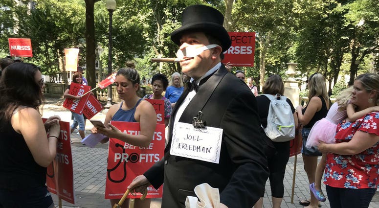 Someone dressed as "Uncle Pennybags" from the board game Monopoly marched with the Hahnemann University Hospital employees. Someone dressed as "Uncle Pennybags" from the board game Monopoly marched with the Hahnemann University Hospital employees.