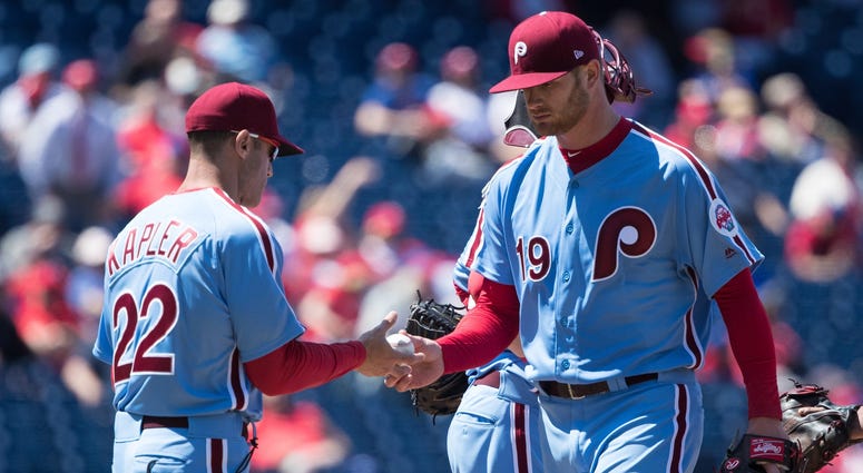 Phillies manager Gabe Kapler (22) takes the ball from starting pitcher Ben Lively (19) for a pitching change during the third inning against the Arizona Diamondbacks at Citizens Bank Park. Phillies manager Gabe Kapler (22) takes the ball from starting pitcher Ben Lively (19) for a pitching change during the third inning against the Arizona Diamondbacks at Citizens Bank Park.