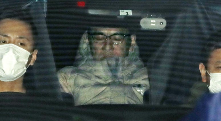 In this March 14, 2019, photo, Japanese musician Pierre Taki in a police car is sent to a prosecutor's office in Tokyo. In this March 14, 2019, photo, Japanese musician Pierre Taki in a police car is sent to a prosecutor's office in Tokyo.