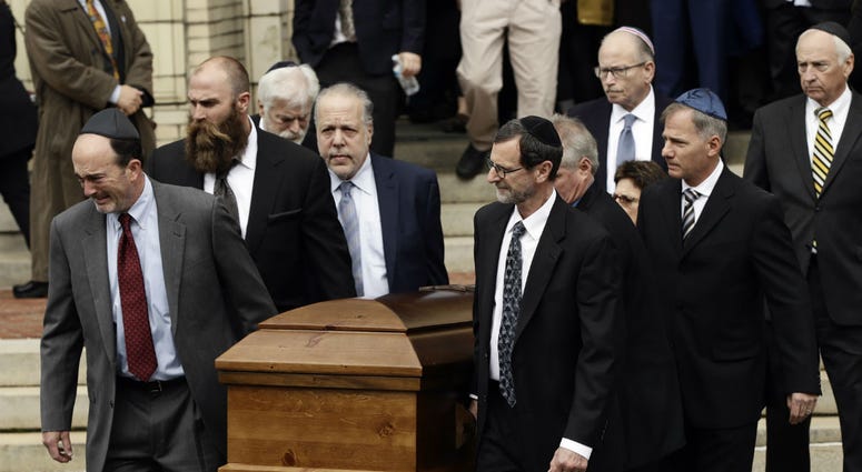 A casket is carried out of Rodef Shalom Congregation after the funeral services for brothers Cecil and David Rosenthal, Tuesday, Oct. 30, 2018, in Pittsburgh. A casket is carried out of Rodef Shalom Congregation after the funeral services for brothers Cecil and David Rosenthal, Tuesday, Oct. 30, 2018, in Pittsburgh.