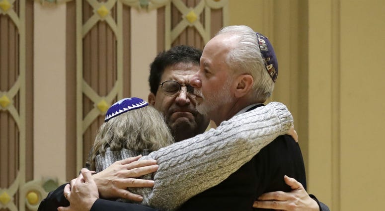 Rabbi Jeffrey Myers, right, of Tree of Life/Or L'Simcha Congregation hugs Rabbi Cheryl Klein, left, of Dor Hadash Congregation and Rabbi Jonathan Perlman during a community gathering held in the aftermath of a deadly shooting at the Tree of Life Synagogue Rabbi Jeffrey Myers, right, of Tree of Life/Or L'Simcha Congregation hugs Rabbi Cheryl Klein, left, of Dor Hadash Congregation and Rabbi Jonathan Perlman during a community gathering held in the aftermath of a deadly shooting at the Tree of Life Synagogue
