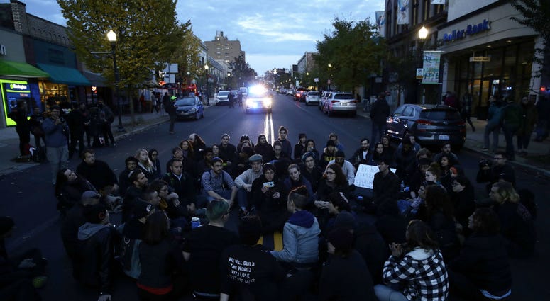 Protesters demonstrate on a main road in the Squirrel Hill neighborhood of Pittsburgh Tuesday, Oct. 30, 2018. Protesters demonstrate on a main road in the Squirrel Hill neighborhood of Pittsburgh Tuesday, Oct. 30, 2018.