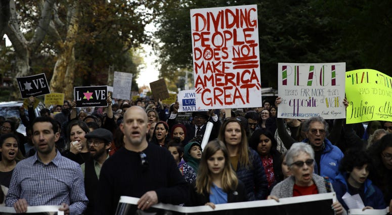Protesters demonstrate near Pittsburgh's Tree of Life Synagogue where President Donald Trump and first lady Melania Trump were visiting a memorial in Pittsburgh, Tuesday, Oct. 30, 2018. Protesters demonstrate near Pittsburgh's Tree of Life Synagogue where President Donald Trump and first lady Melania Trump were visiting a memorial in Pittsburgh, Tuesday, Oct. 30, 2018.