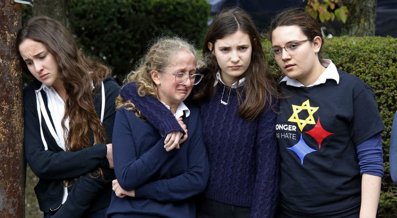 Students from the Yeshiva School in the Squirrel Hill neighborhood of Pittsburgh, pay their respects as the funeral procession for Dr. Jerry Rabinowitz passes their school en route to Homewood Cemetery. Students from the Yeshiva School in the Squirrel Hill neighborhood of Pittsburgh, pay their respects as the funeral procession for Dr. Jerry Rabinowitz passes their school en route to Homewood Cemetery.