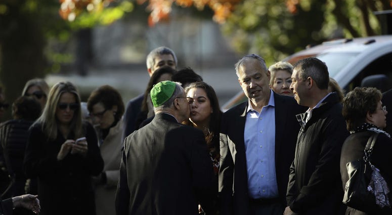 Mourners gather outside Rodef Shalom Congregation before the funeral services for brothers Cecil and David Rosenthal, Tuesday, Oct. 30, 2018, in Pittsburgh. Mourners gather outside Rodef Shalom Congregation before the funeral services for brothers Cecil and David Rosenthal, Tuesday, Oct. 30, 2018, in Pittsburgh.