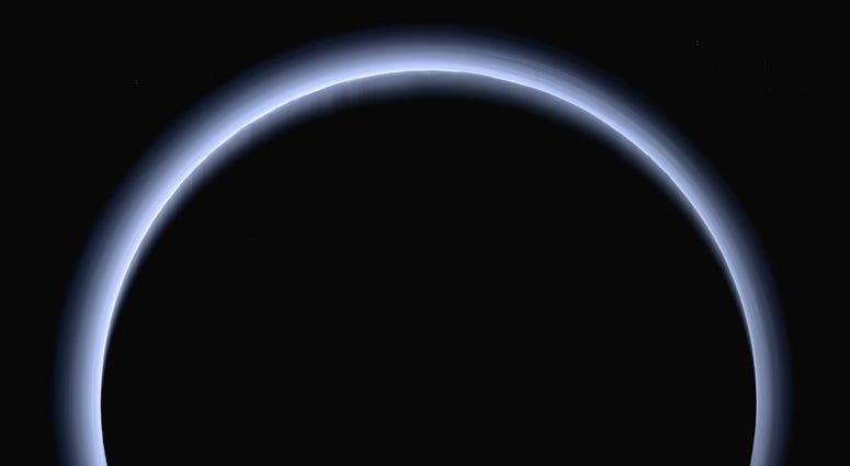 This image made available by NASA in March 2017 shows Pluto illuminated from behind by the sun as the New Horizons spacecraft travels away from it at a distance of about 120,000 miles (200,000 kilometers). This image made available by NASA in March 2017 shows Pluto illuminated from behind by the sun as the New Horizons spacecraft travels away from it at a distance of about 120,000 miles (200,000 kilometers).