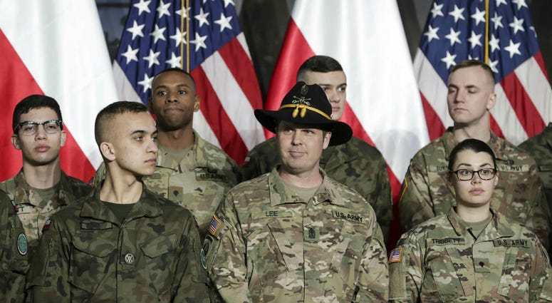 Soldiers from Poland and the United States wait for Vice President Mike Pence at the airport in Warsaw, Poland, Wednesday, Feb. 13, 2019. Soldiers from Poland and the United States wait for Vice President Mike Pence at the airport in Warsaw, Poland, Wednesday, Feb. 13, 2019.