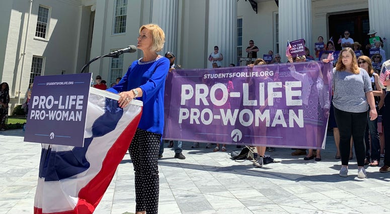 In this Wednesday, May 22, 2019, file photo, Beck Gerritson, president of Eagle Forum of Alabama, speaks at an anti-abortion rally outside the Capitol in Montgomery, Ala. In this Wednesday, May 22, 2019, file photo, Beck Gerritson, president of Eagle Forum of Alabama, speaks at an anti-abortion rally outside the Capitol in Montgomery, Ala.