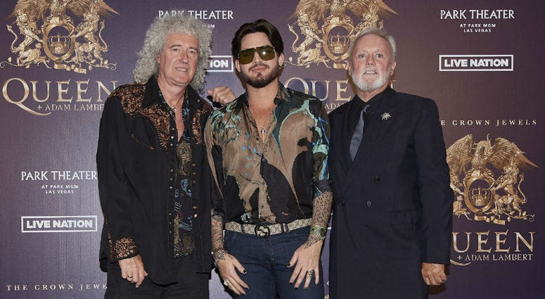 In this Aug. 28, 2018, file photo, Brian May, from left, Adam Lambert, and Roger Taylor of Queen + Adam Lambert pose for a photo at the "The Crown Jewels" residency press conference at the MGM Resorts aviation hanger in Las Vegas. In this Aug. 28, 2018, file photo, Brian May, from left, Adam Lambert, and Roger Taylor of Queen + Adam Lambert pose for a photo at the "The Crown Jewels" residency press conference at the MGM Resorts aviation hanger in Las Vegas.