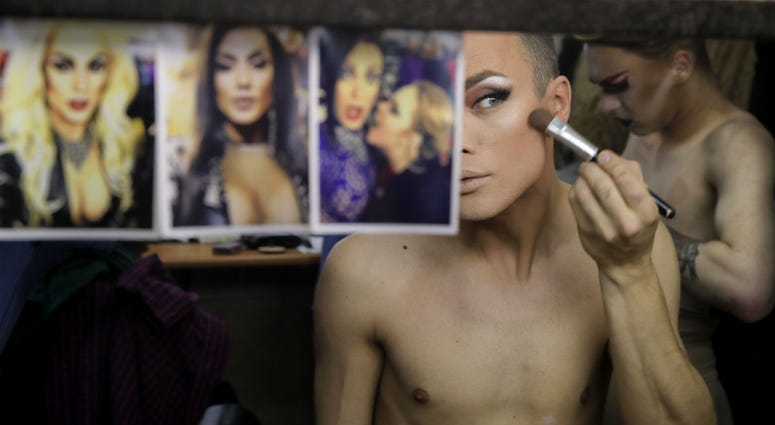 In this picture taken Sunday, June 24, 2018, Andrei, who uses the stage name Star Vasha, applies make up before performing at a gay club during the 2018 soccer World Cup in Yekaterinburg, Russia. In this picture taken Sunday, June 24, 2018, Andrei, who uses the stage name Star Vasha, applies make up before performing at a gay club during the 2018 soccer World Cup in Yekaterinburg, Russia.