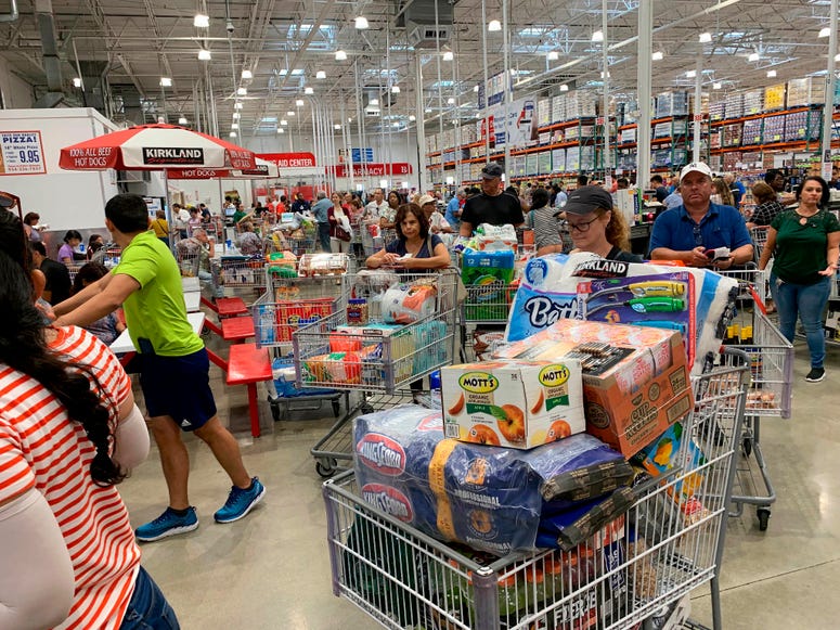 Shoppers wait in long lines at Costco, Thursday, Aug. 29, 2019, in Davie, Fla., as they stock up on supplies ahead of Hurricane Dorian. Hurricane Dorian preparations