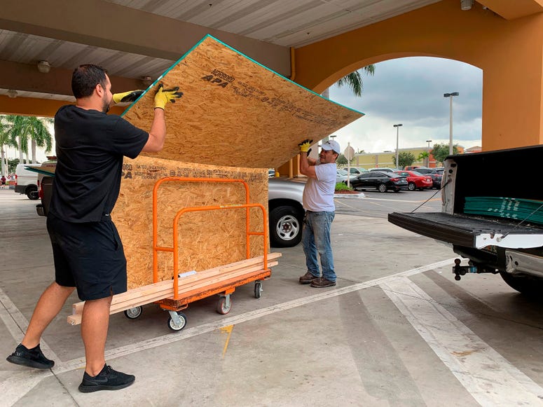 Shoppers load their truck with supplies to prepare ahead of Hurricane Dorian at The Home Depot on Thursday, Aug. 29, 2019, in Pembroke Pines, Fla. Hurricane Dorian preparations
