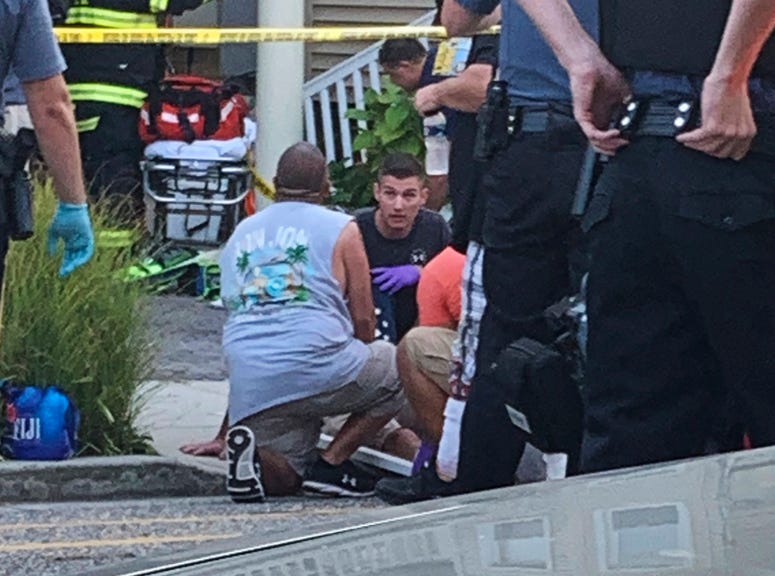 In this photo provided by James Macheda, first responders treat an injured person as they work the scene of a building structure damage in Wildwood, N.J., Saturday, Sept. 14, 2019. First responders treat an injured person as they work the scene of a building structure damage in Wildwood, N.J.