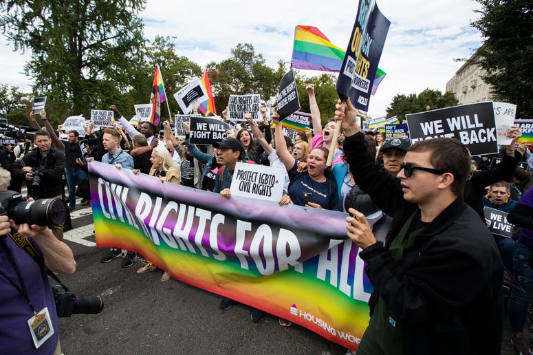 Supporters of LGBT rights stage a protest on the street in front of the U.S. Supreme Court, Tuesday, Oct. 8, 2019, in Washington. LGBT rights
