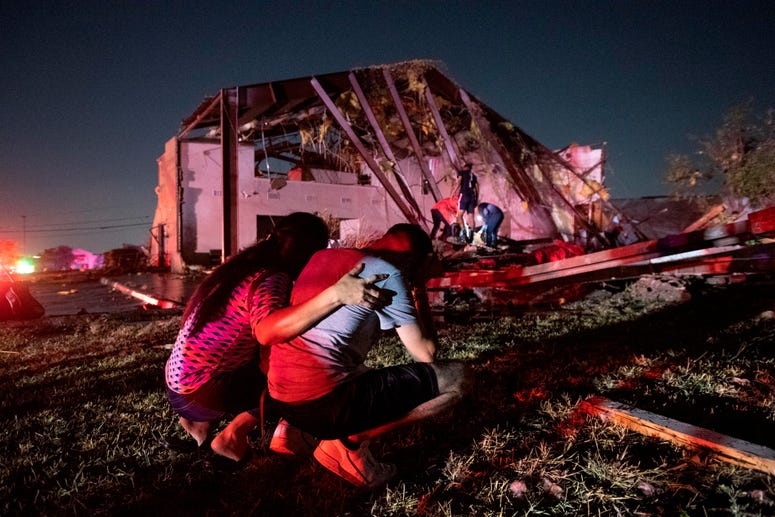 Henry Ramirez, a member of Primera Iglesia Dallas, is consoled by his mother Maribel Morales as they survey severe damage to the church, where Ramirez plays drums and Morales attends, after a tornado tore through North Dallas. Henry Ramirez, a member of Primera Iglesia Dallas, is consoled by his mother Maribel Morales as they survey severe damage to the church, where Ramirez plays drums and Morales attends, after a tornado tore through North Dallas.