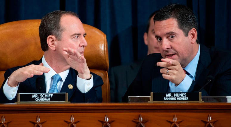House Intelligence Committee Chairman Rep. Adam Schiff, D-Calif., left, talks with ranking member Rep. Devin Nunes, R-Calif., during a hearing of the House Intelligence Committee. Adam Schiff and Devin Nunes