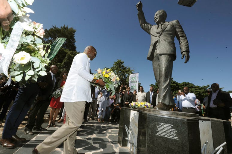 Wreaths are laid at a statue of former President Nelson Mandela at the entrance to the Victor Verster prison in Paarl, South Africa, Tuesday, Feb. 11, 2020. Wreaths are laid at a statue of former President Nelson Mandela at the entrance to the Victor Verster prison in Paarl, South Africa, Tuesday, Feb. 11, 2020.