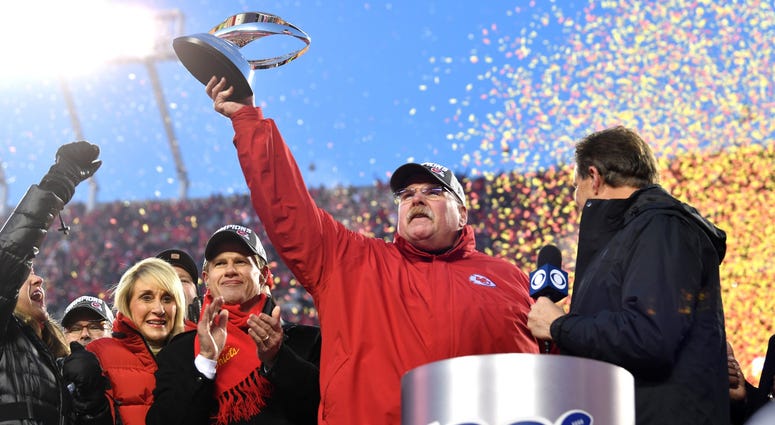 Head coach Andy Reid of the Kansas City Chiefs holds up the Lamar Hunt trophy after defeating the Tennessee Titans in the AFC Championship Game at Arrowhead Stadium on January 19, 2020 in Kansas City, Missouri. The Chiefs defeated the Titans 35-24. Andy Reid