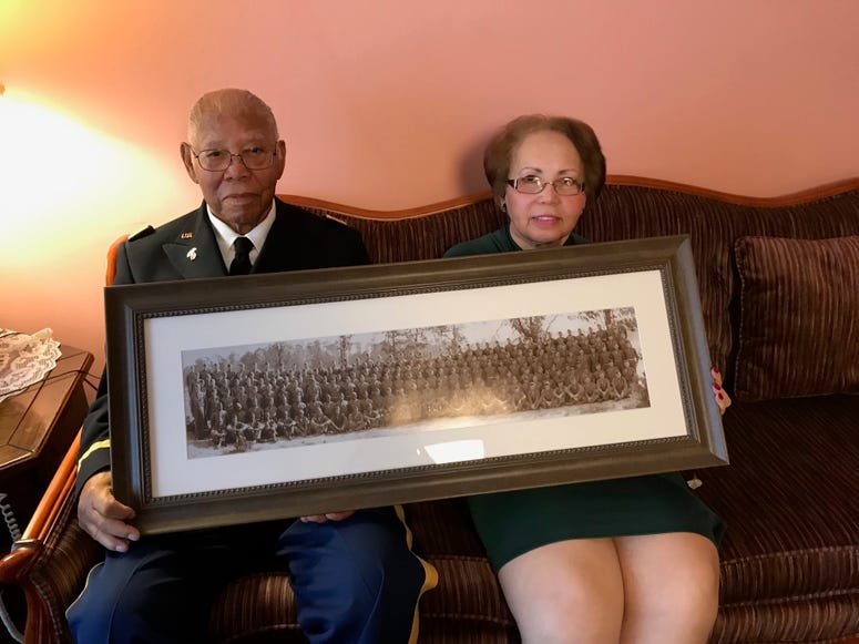 Marion Lane and her father John E. James, Jr. hold his graduation photo Marion Lane and her father John E. James, Jr. hold his graduation photo