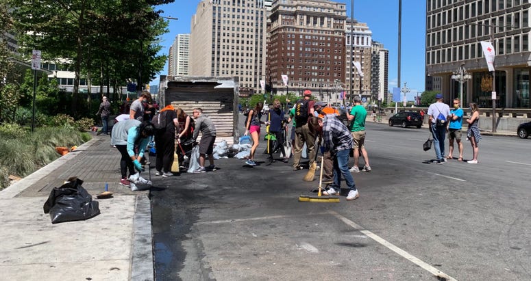 People helping to clean up in the City Hall area Sunday morning. People helping to clean up in the City Hall area Sunday morning.