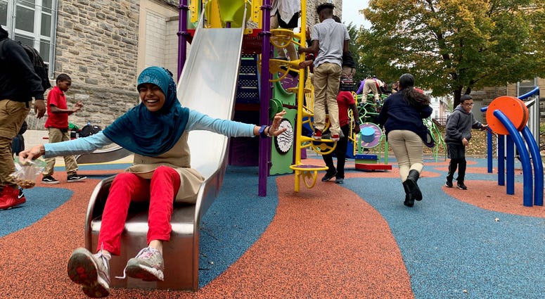 Students play at the newly built inclusive playground at Overbrook Educational Center. Overbrook Educational Center playground