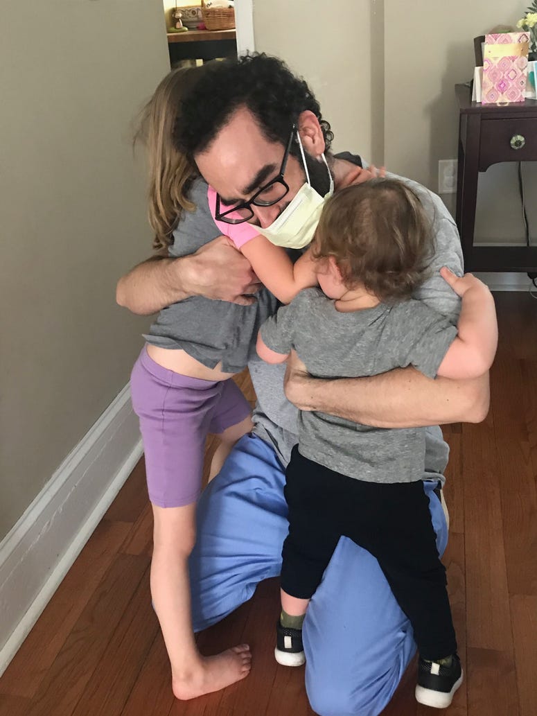 Philadelphia man Justin Gilmore is reunited with his daughters after a hospital stay. Justin Gilmore with daughters