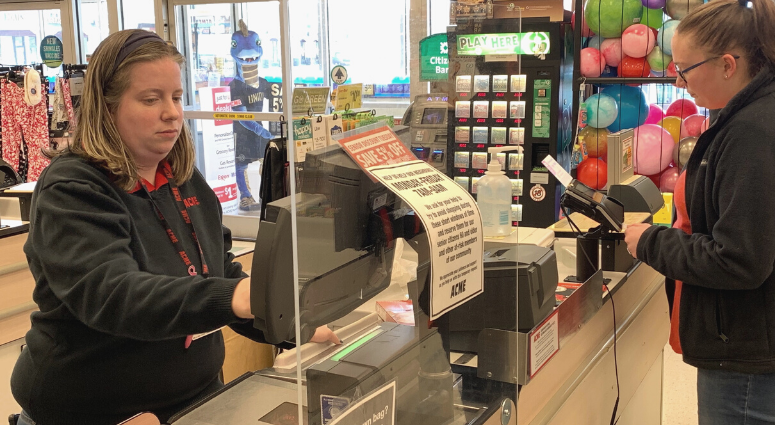 Supermarkets, including Acme and Giant, are installing Plexiglas partitions to separate cashiers from customers and to slow the spread of COVID-19. Barrier at store counter for prevent spread of COVID-19