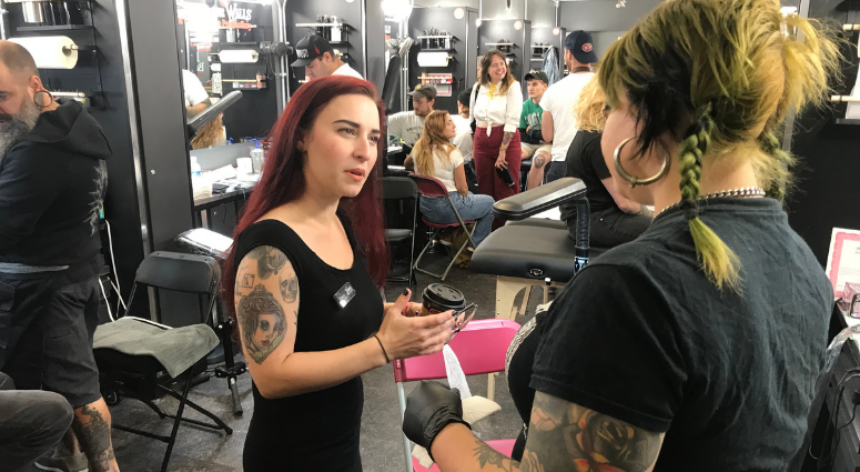 Casey Paul (left) plays a zombie nurse in Terror Behind the Walls, so she got a tattoo of it on her forearm. Terror Behind the Walls