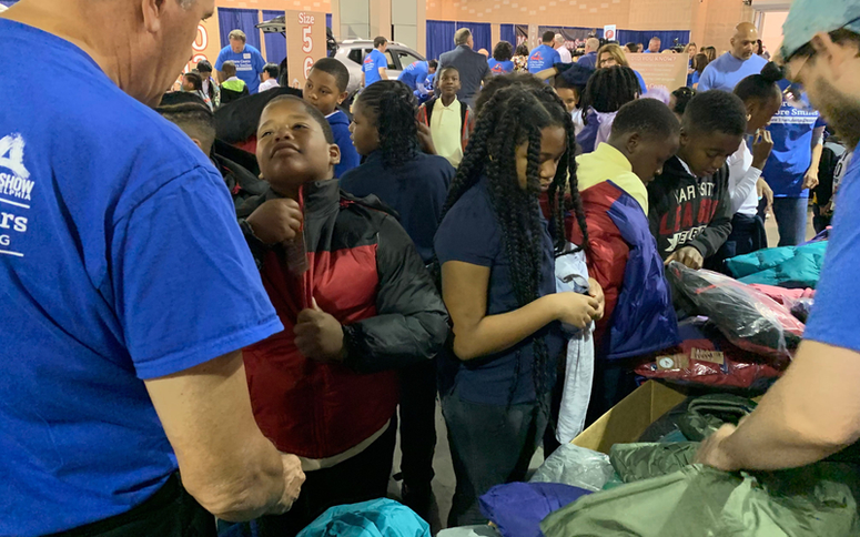 More than 1,000 students from four elementary schools within the School District of Philadelphia had the chance to pick out new winter coats during the Driving Away the Cold event at the Pennsylvania Convention Center, Oct. 8, 2019. Driving Away the Cold event