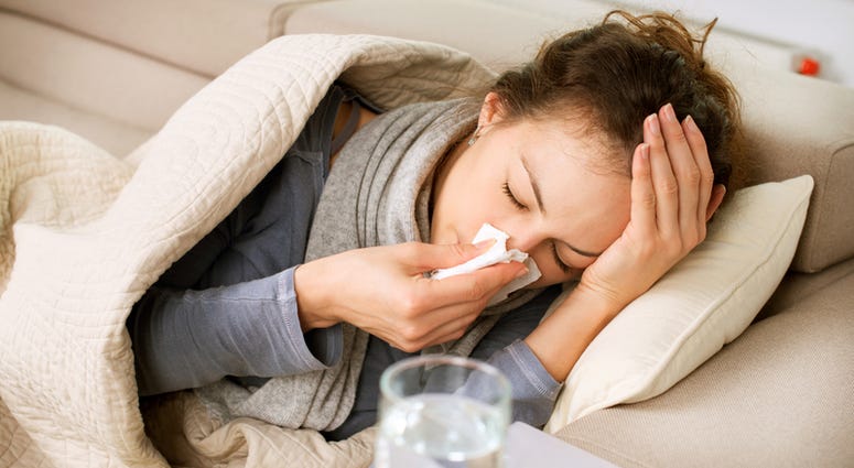 Sick Woman. Flu. Woman Caught Cold. Sneezing into Tissue Cold Flu