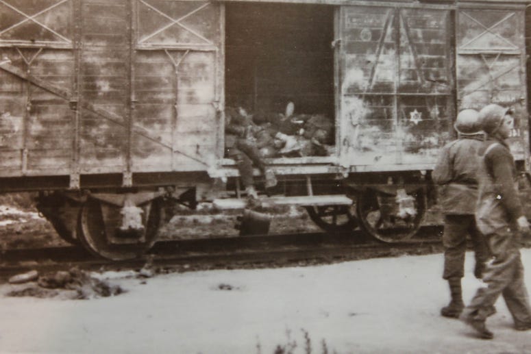 In this dated photo provided to Don Greenbaum by a medic, boxcars at Dachau were abandoned with bodies inside. Boxcars at Dachau