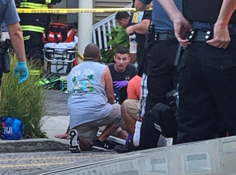 In this photo provided by James Macheda, first responders treat an injured person as they work the scene of a building structure damage in Wildwood, N.J., Saturday, Sept. 14, 2019. First responders treat an injured person as they work the scene of a building structure damage in Wildwood, N.J.