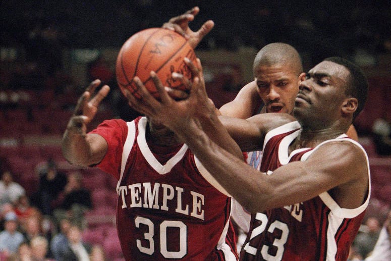 In this Dec. 29, 1993, file photo, Temple's Jason Ivey (30) and Aaron McKie (23) struggle for possession as Fairleigh Dickinson's Donald Osbourne approaches during the consolation game of the ECAC Holiday Festival Tournament in Madison Square Garden. Aaron McKie plays for Temple in 1993