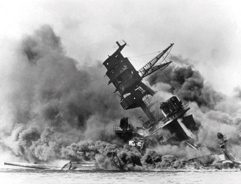 In this Dec. 7, 1941 file photo, smoke rises from the battleship USS Arizona as it sinks during the Japanese attack on Pearl Harbor, Hawaii. In this Dec. 7, 1941 file photo, smoke rises from the battleship USS Arizona as it sinks during the Japanese attack on Pearl Harbor, Hawaii.