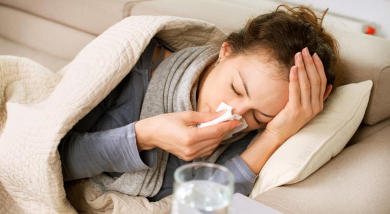 Sick Woman. Flu. Woman Caught Cold. Sneezing into Tissue Cold Flu